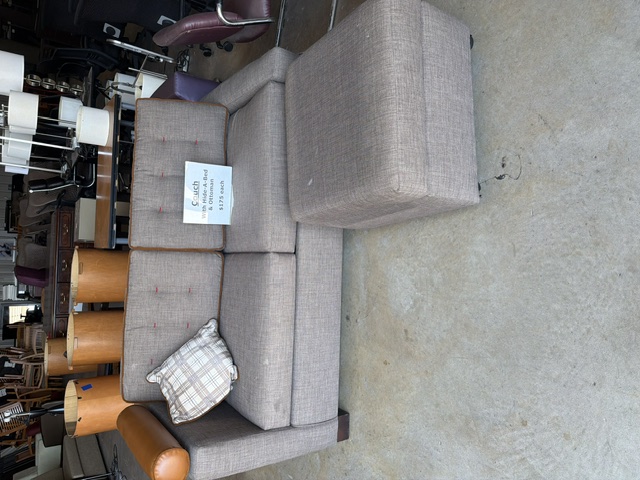 Sofa with ottoman on the warehouse floor